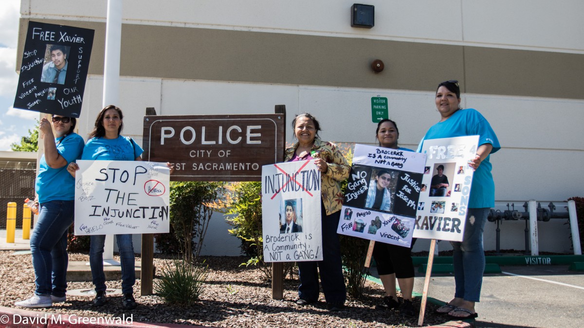 Four mothers of juveniles held in custody stand in from of the West Sac Police Station. Left to right: Tara Westford, Gloria Garcia, organizer Maria Grijalva (center), Regina Martinez, and Cathy Perez.